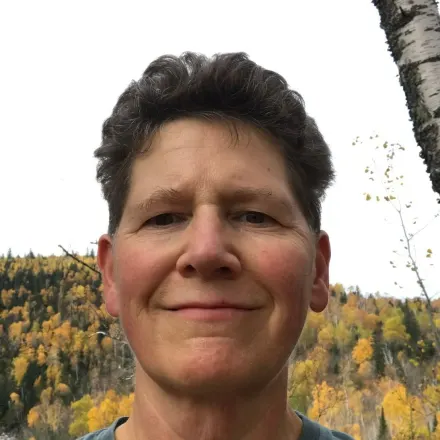 Dr. Kate French with a forest in the background